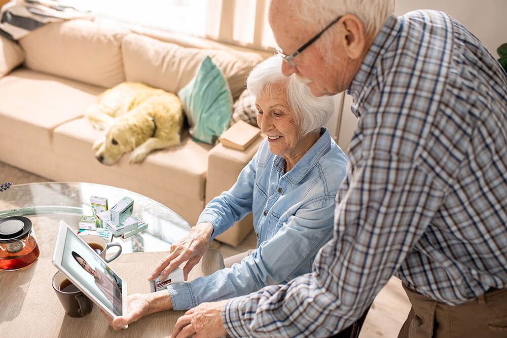 cheerful-elderly-couple-using-digital-tablet – Friends CoCCP